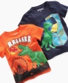 This Greendog tee is dino-mite, featuring a colorful graphic of a dinosaur playing video games or a dinosaur at a fair.