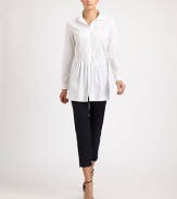 Crisp woven cotton, tailored in a flattering silhouette featuring delicate front pleats.Point collarButton frontPleated frontLong sleeves with button cuffsAbout 29 from shoulder to hem83% cotton/14% polyamide/3% elastaneDry cleanMade in Italy of imported fabric Model shown is 5'11 (180cm) wearing US size 4.OUR FIT MODEL RECOMMENDS ordering true size. 