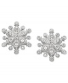 With a winter-inspired motif, Swarovski's pair of pierced earrings is ideal for the cold months. It sparkles in clear crystal pavé and delicately crafted, rhodium-plated metal. Fancy pear-shaped crystals add a touch of classic elegance. Approximate diameter: 3/5 inch.