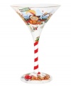 Enjoy an ice-cold cocktail in the North Pole-tini martini glass by Lolita. Hand painted with peppermint stripes, mischievous elves and a view of Mrs. Claus' bakery, it offers a very merry taste of Santa's hometown celebration. With cherry and cream drink recipe on base.