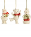 A set of three happy-go-lucky ornaments decorate your tree, featuring Santa Claus, a teddy bear and a snowman with gold embellishments and red ribbon bows. Crafted of porcelain from Lenox.