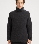 A soft jersey wool blend shapes a classic, versatile wardrobe staple for those approaching wintry days and nights.Turtleneck80% mercerized wool/20% nylonDry cleanImported