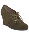 Propped up style that's oh-so-smooth. Aerosole's Bella Vita booties feature a self-covered wedge and a lace-up vamp.