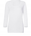 Stylish long sleeve shirt in white stretch cotton - very fine and comfortable quality - feminine cut with broad trimmed crew neck and long sleeves - waist fitted, nice and long, sexy figure hugging cut - your new favorite basic, the one you always need, the one youve always been looking for - wear solo or underneath - pair at leisure time with tube jeans, shorts, skirts, at the office with a pant suit