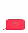 Detailed in durable neoprene with an allover logo print, Marc by Marc Jacobs zip-around wallet is a fun and covetable choice for stashing away your everyday essentials - Tonal logo plaque, zip-around closure, zippered change purse, multiple credit card slots - Carry alone for running quick errands, or slip into a brightly printed handbag