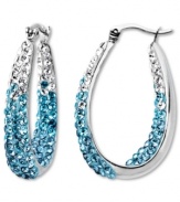 Frost yourself with cool blue hues. Kaleidoscope's standout hoop earrings feature an ombre effect with round-cut crystals ranging in color from aqua to clear with Swarovski Elements. Set in sterling silver. Approximate drop: 1-1/10 inches.