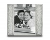 Clear crystal filled columns decorate two sides of the frame; silver-tone metal structure. Designed by Sharon Weinberg. The frame is 5 15/16 x 5 inch.