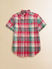 A tried-and-true button-front design is rendered in a vibrant madras plaid.Button-down collarShort sleevesButton frontBox-pleated backShirttail hemCottonMachine washImported Please note: Number of buttons may vary depending on size ordered. 