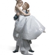 The handsome groom carries his blushing bride over the threshhold in this romantic scene from Lladro. Porcelain. Measures 10.75 x 6.75.