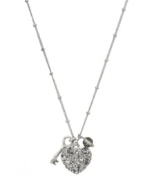 The key to every girl's heart involves a little glamour. Fossil's keepsake pendant features a crystal-coated heart, a small key charm, and a faceted glass bead. Setting, chain and lobster claw clasp crafted in silver tone mixed metal. Approximate length: 16 inches + 2-inch extender. Approximate drop: 3/4 inch.