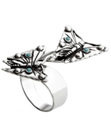 Beautiful butterflies emerge from this wrapped ring with delicate precision. Accented with bits of reconstituted turquoise this silver tone Fossil ring is made of mixed metal and comes in sizes 7 and 8.