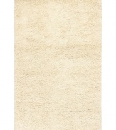 Step onto a cloud-soft area rug in rich, felted ivory wool. Offering one of the thickest, plushest hands in the industry, the Surya Metropolitan area rug billows with softness in every space.