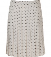 Elegant pleated skirt in fine ivory silk - Retro chic meets modern sophistication - On-trend black polka dot motif - Slim cut, hits at knees - Pleats swing lightly when walking - Polished, smart and sexy, ideal for work, cocktails and parties - Pair with a twin set or blazer and button down blouse, style with pumps or mules