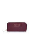 Stash away your most valuable essentials in Marc by Marc Jacobs deep cardamom zip around leather wallet - Classic rectangle shape, front logo plaque, zip around closure, multiple inside pockets for cards, IDs, and bills - Perfect for tucking away in chic carryall totes