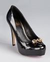 In polished patent, these ultra feminine DV Dolce Vita pumps take a seductive stance on the platform.