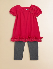 Sweet bows, sequins and ruffles adorn this adorable sweater tunic and leggings set.  Tunic Ribbed roundneckShort puff sleevesBow and sequin accentsRuffled hemBack keyhole with button closure Leggings Elastic waistbandPull-on styleTunic: cotton/acrylicLeggings: cotton/spandexMachine washImported