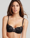 An exceptionally pretty underwire bra with intricate floral lace and a large sheer mesh bow at front.