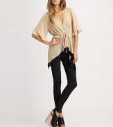 Utterly-romantic in a draped silk button-down, finished with flutter sleeves and a contour hem.V necklineShort sleevesButton-down frontSelf-beltContrast stripe at hemGathered pleats at backAbout 24 from shoulder to hemSilkDry cleanImported