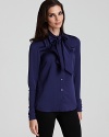 Anne Klein's bow-tie blouse brings on-trend elegance to workday style--perfect with a sleek pencil skirt or trousers.