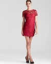 A simple sheath in floral lace boasts timeless style. From Aidan Mattox.