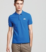 A modernized preppy classic. With an ultra slim fit and a super-sized logo, this stylish polo from Lacoste is a must-have basic.