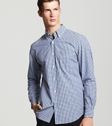 Tried-and-true gingham is made modern with a sophisticated button down shirt from Lacoste.