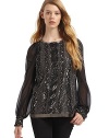 THE LOOKCrew necklineOrnate beadwork adorns the front bodice, cuffs and hemChiffon long sleeves with three-button-and-loop cuffsExposed back zipperTHE FITAbout 26 from shoulder to hemTHE MATERIALSilkCARE & ORIGINSpot cleanMade in USA of imported fabric