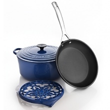 Exclusively ours, this 4 piece set from Le Creuset features a 5.5-qt. round French oven with lid, 9.5 forged hard anodized fry pan and a cast iron trivet.