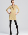 This Tibi sweater dress taps into the season's metallic trend in a short and chic silhouette. Pare it down at the office with a black blazer or amp it up for cocktail hour with matching golden accessories.