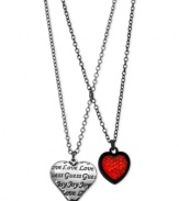 Hearts in the right place. This two-row necklace from GUESS is crafted from hematite-tone mixed metal with two heart pendants providing plenty to love. Item comes packaged in a signature GUESS Gift Box. Approximate length: 15 inches + 2-inch extender. Approximate drop: 1-1/4 inches.