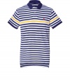 A warm-weather must-have, this polo shirt is created with classic American style in fine, blue and white striped cotton - Contrasting yellow stripe and small, red Ralph Lauren signature embroidered polo horse - Small collar, short button placket and slim fit - Traditional length with back slightly longer than front - Pair with jeans, chinos or shorts for an American preppy look