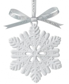 A traditional symbol of the winter season, this unique snowflake ornament features ornate craftsmanship in pure white porcelain. From Wedgwood.