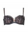 Get the sultry glamorous look of a vintage 1950s pin up girl in Von Follies by Dita Von Teeses black and nude stretch lace balconette bra - Underwire style with wired sides, lightly padded structured cups, grosgrain and satin ribbon detailing over sheer black stretch lace, ruffled lace trim on cups, laced satin wide adjustable straps with silver-toned hardware, sheer mesh sides, iconic soft elastic triangle cross back detail, adjustable silver-toned back hook-and-eye closures - Wear with the matching thong for a seriously seductive look