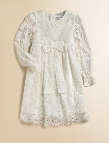 Nothing's lovelier for your young lady than the airy swirls of this lavish lace frock with a flowing skirt and a scalloped hem.Round necklineLong sleeves with ruffled cuffsEmpire waist with bowBack button closeSilk/cotton liningRayon/cotton/nylon/silkDry cleanImported Please note: Number of buttons may vary depending on size ordered. 