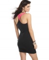 Score sporty style with a twist in this racerback tank dress from Material Girl!