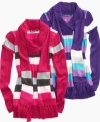 A snug fit to keep her warm this winter, this shawl-collar tunic sweater from Planet Gold is a sweet, snow-bound style.