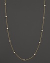 Diamond stations shine on an elegant yellow gold necklace.