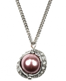 Lovely and lustrous. A mauve glass pearl sets apart this pretty pendant necklace from Givenchy. Surrounded by sparkling clear glass accents, it's set in silver tone mixed metal. Approximate length: 16 inches + 3-inch extender. Approximate drop: 1 inch.