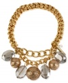 Eclectic elegance. Kenneth Cole New York's half stretch bracelet, crafted from gold-tone mixed metal, brings together gold-colored glitter and faceted oval beads to stunning effect. Item comes packaged in a signature Kenneth Cole New York Gift Box. Approximate diameter: 2-1/2 inches.