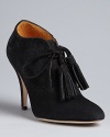 Bettye Muller combines stylish pointed toes and oxford details in these must-have high heels.