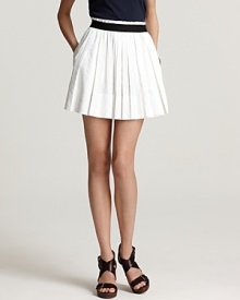 The spring runway called for plenty of pleats and this white Theory skirt takes on the trend with stylish skill--a building block for your new-season collection complete with a black waistband for smart color blocking.