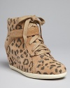 These Rebecca Taylor high top sneaker wedges are oh-so stylish; they add a little height to your standby weekend look.