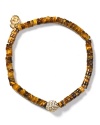 Follow your feline instincts and flaunt MICHAEL Michael Kors' tiger's eye bracelet--the fierce wristpiece lends exotic flair to staple tees or femme blouses.