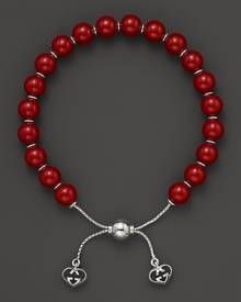 Varnished red wooden beads on a sterling silver bracelet from Gucci.