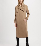 Modernized by an asymmetrical zipper, this military-inspired trenchcoat has notched lapels, slash pockets and a back vent for mobility. Notched lapelsButton frontAsymmetrical zipperLong sleeves with buttoned cuffsSlash pocketsButtoned back belt; back ventAbout 36 from shoulder to hemCottonDry cleanMade in ItalyModel shown is 5'10 (177cm) wearing US size 2.