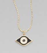 This protective evil eye, strung from a 14k yellow gold chain, is richly punctuated by a black diamond. Diamond, 0.2 tcw Enamel 14k yellow gold Chain length, about 16 Pendant width, about ½ Claw clasp Made in USA 