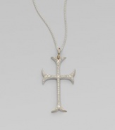 A graceful French Gothic cross sparkles with the dazzle of diamonds set in sterling silver on a woven silver chain with gold accents.Diamonds, .60 tcwSterling silver and 14k yellow goldChain length, about 18Pendant length, about 1½Spring ring claspMade in USA