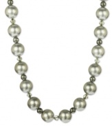 A splendid mix of shimmer. This stunning necklace combines shell beads (14 mm), sparkling hematite (34-3/4 ct. t.w.) and Swarovski Elements. Set in sterling silver.  Approximate length: 18 inches.