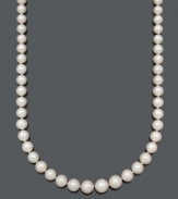 Celebrate traditional sophistication with a beautiful strand of pearls. Belle de Mer necklace features a graduated strand of A+ cultured freshwater pearls (8-12 mm) with a 14k gold clasp. Approximate length: 18 inches.