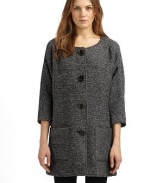 A simple collarless shape in a luxurious wool blend, with dolman sleeves and rustic wooden buttons.Round neckline Seamed yoke, front and back ¾ kimono sleeves Button front Dual patch pockets at front Fully lined About 33 from shoulder to hem 78% wool/18% polyester/4% other fibers Dry clean Made in USA